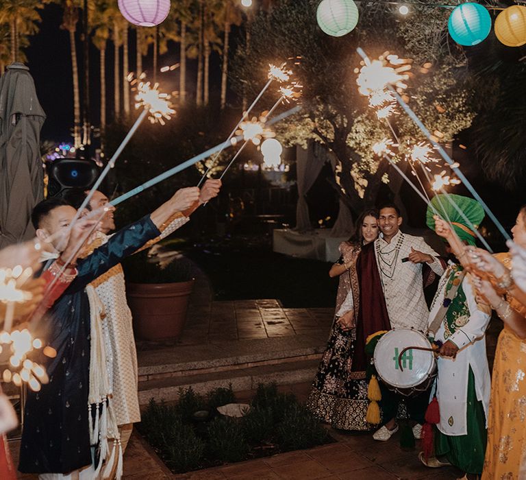 Colourful wedding sparkler exit at destination multicultural wedding 