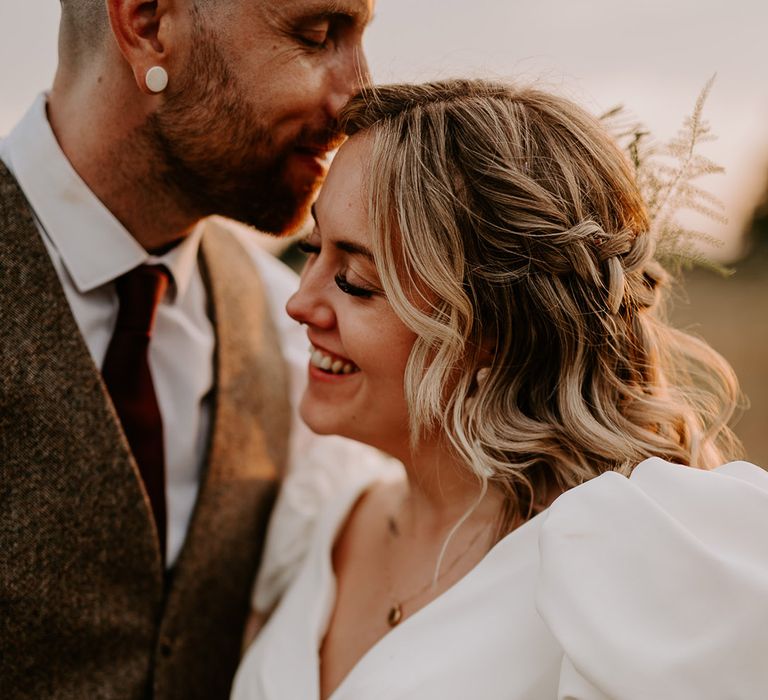 Bride wears a wedding gown with short puff sleeves 