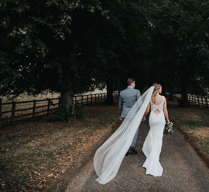 Bride in cathedral length veil from Joyce Jackson