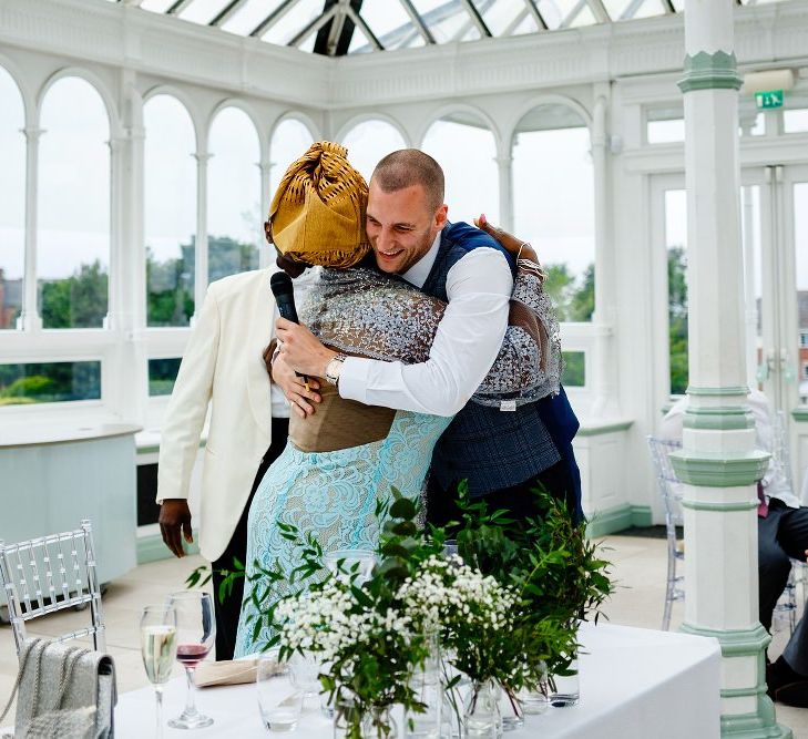 Groom hugging his new mother in law 