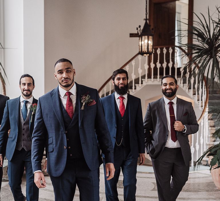 Groomsmen in navy suits at intimate micro wedding 