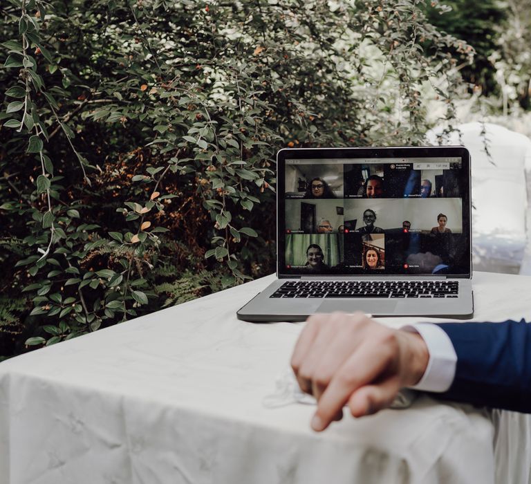 Laptop on table at outdoor civil ceremony