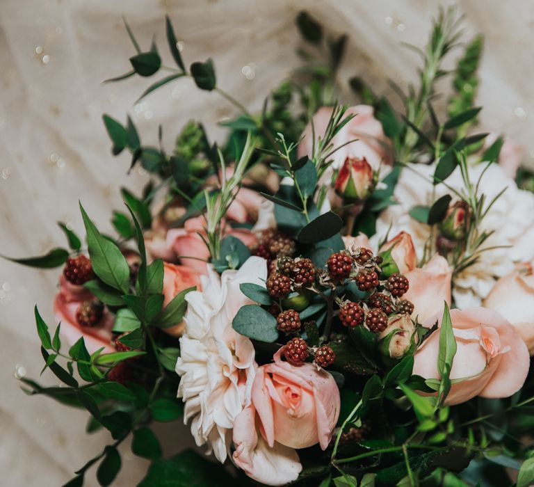 Floral bouquet with green foliage and pale pink tulips 