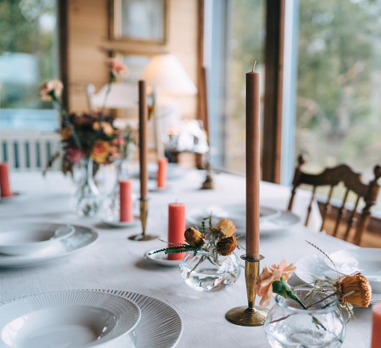 Subtle flower details in mini vases decorated the wedding dining table