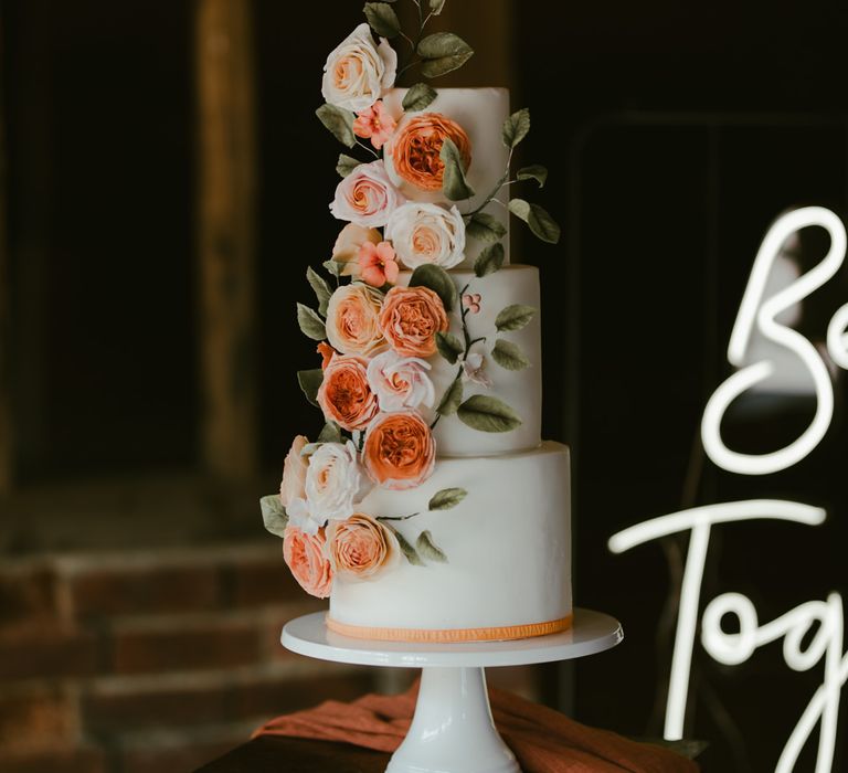 Modern cake design complete with floral decoration 