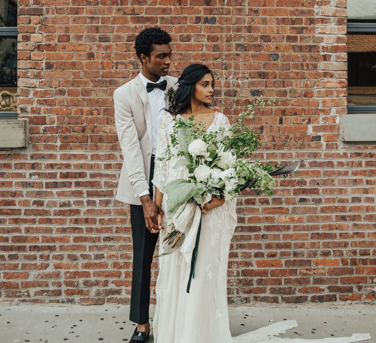 Oversized wedding bouquet with giant white flowers and foliage 