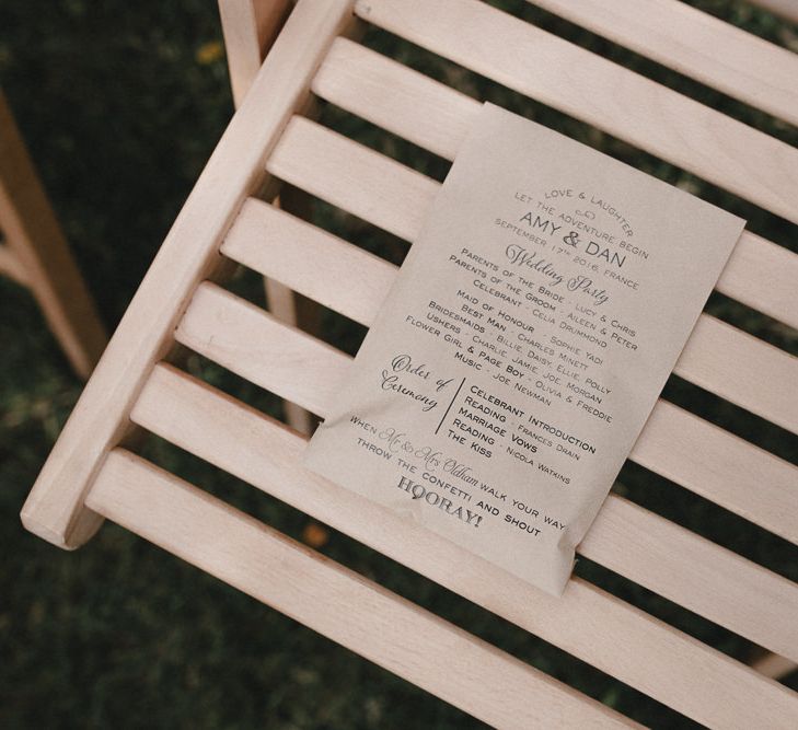 Single page brown paper wedding order of service photographed by Sebastien Boudot