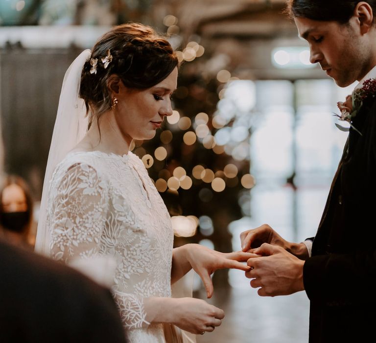 Bride and groom exchanging rings at hackney wedding