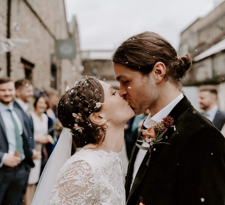 Bride and groom kissing on their wedding day