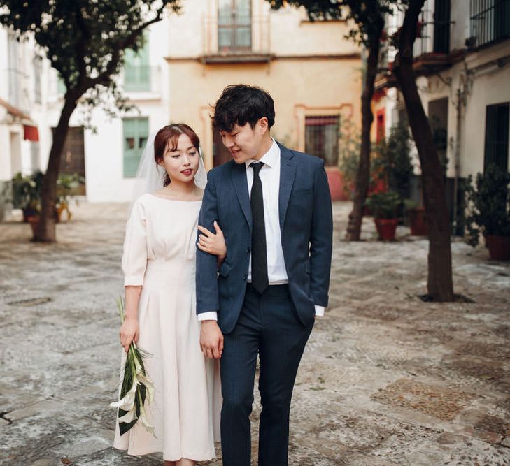 Asian couple in plaza in Seville