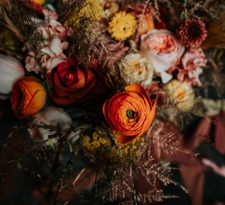 close orange ranunculus wedding flower in autumn bouquet 