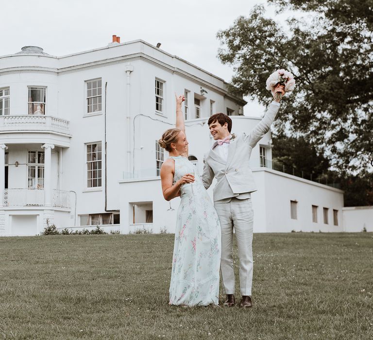 Bride & groom stand within the grounds of Belair House on the day of their wedding