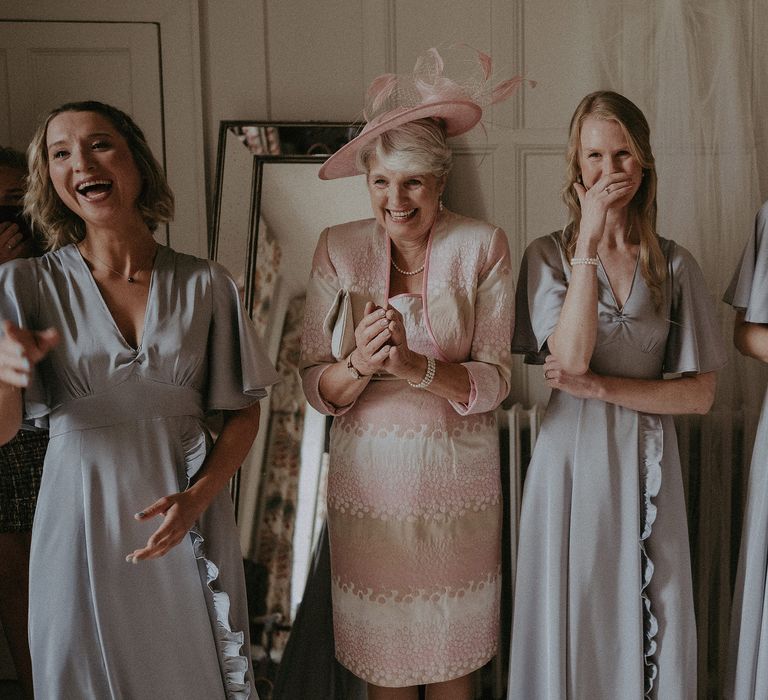 Bridesmaids see bride for the first time and become emotional