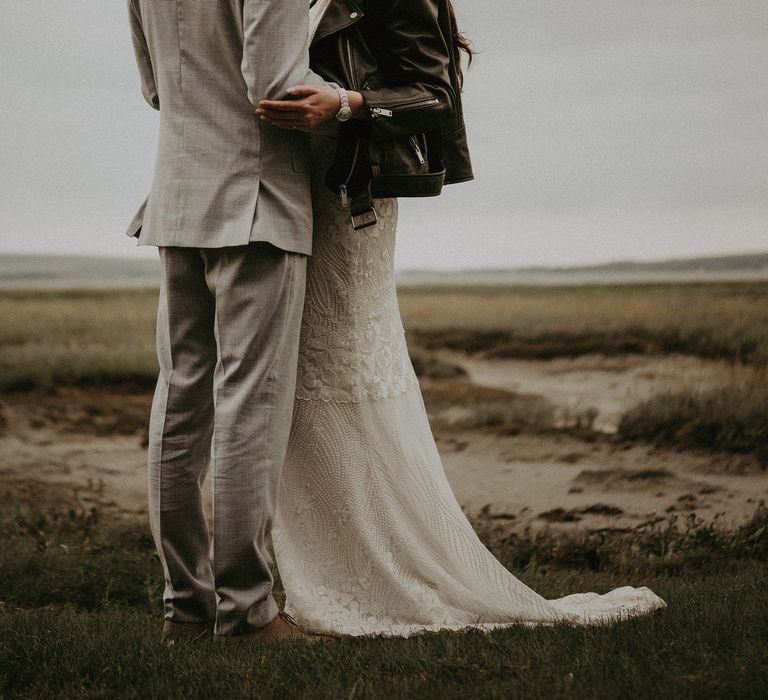 Bride in leather jacket wears a satin hair bow