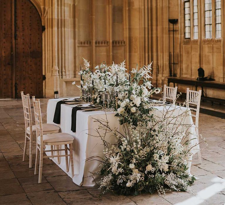 Monochrome tablescape at Bodleian with black and white flowers and table decor including roses 