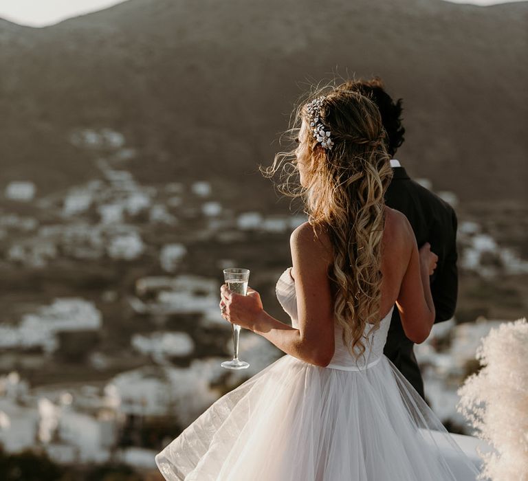 Bride & groom look across Greece on their wedding day