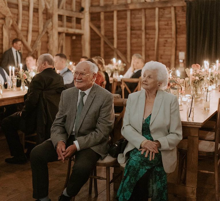 Wedding guests look on at The Barns at Redcoats