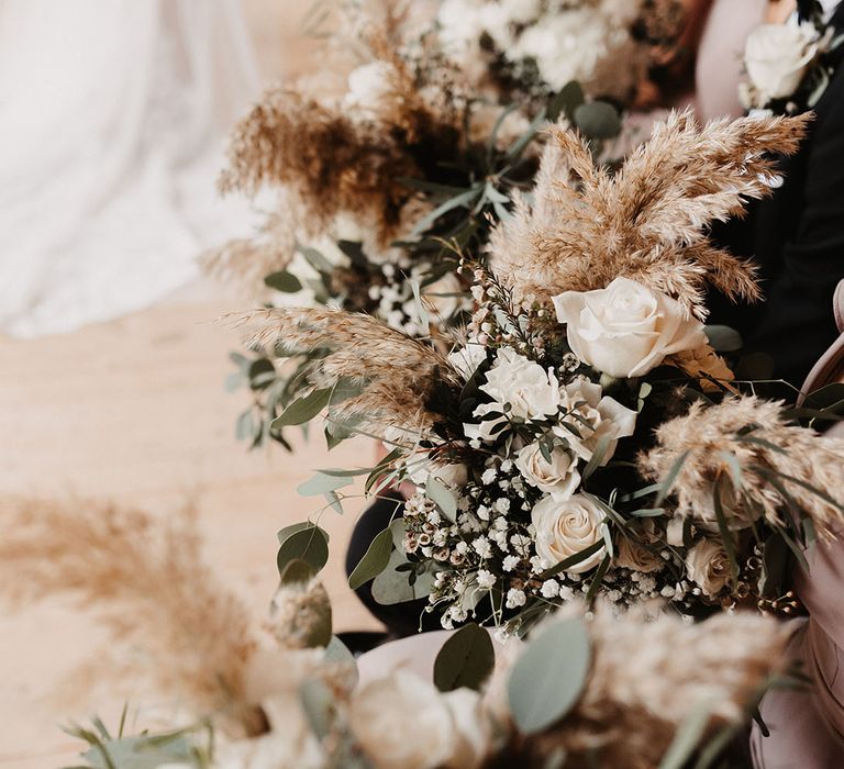 Dried flower and white rose wedding bouquets for winter wedding at Christmas at Hidden River Barn 