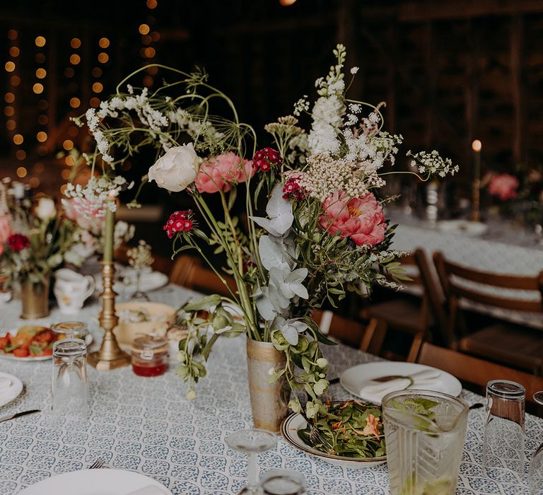 Wedding flower arrangement decor in silver and gold cup vase for rustic barn wedding