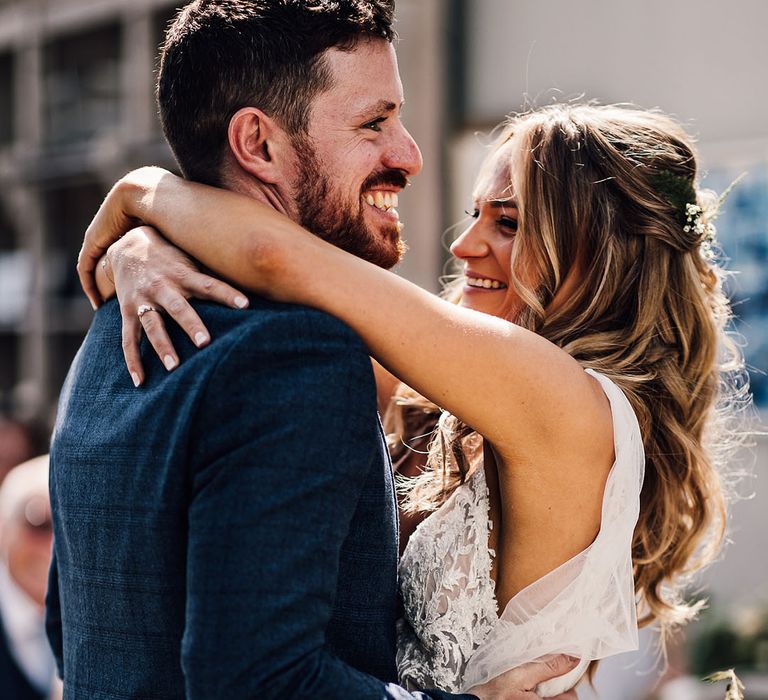 Bride and groom share an embrace 