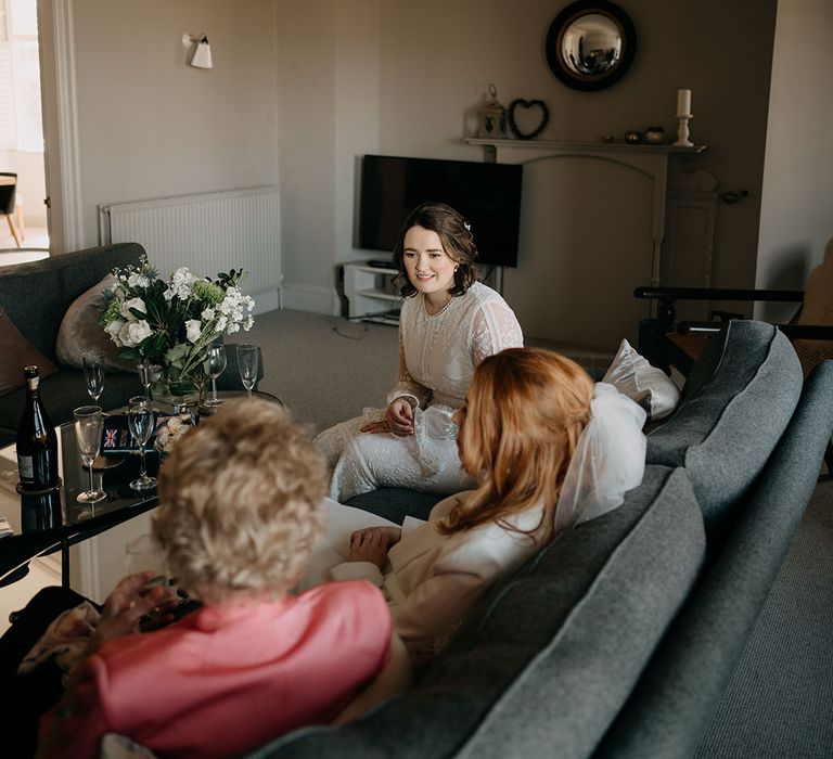 Brides sit together on their wedding day