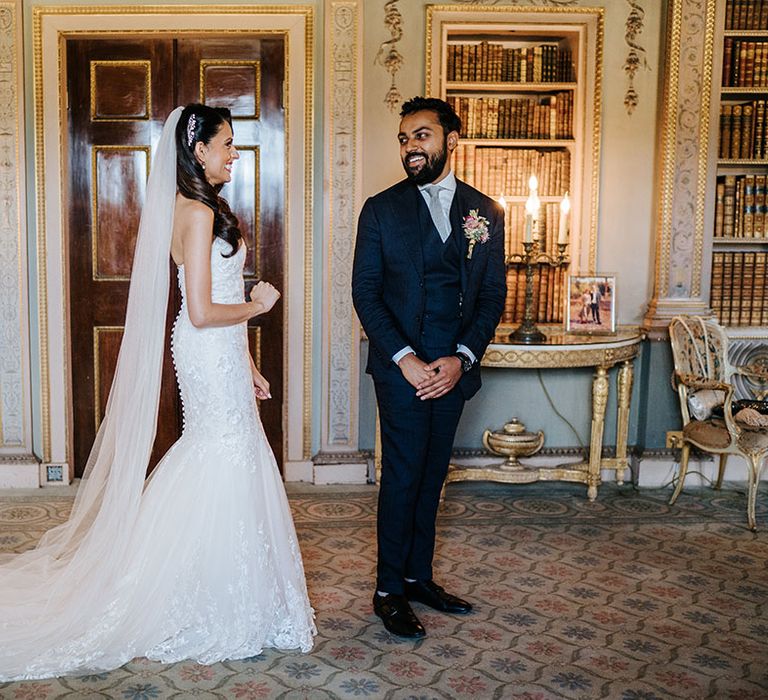 Bride & groom see one another on their wedding day during first-look moment at Syon Park 