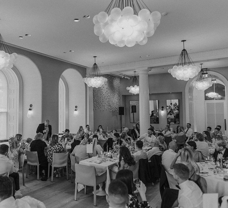 Somerset House wedding venue reception room with large avant garde bauble chandeliers and bay windows