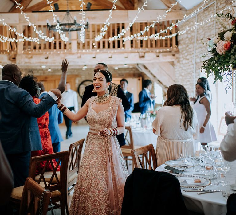 Bride and Groom walk through Caswell House reception after their first introduction