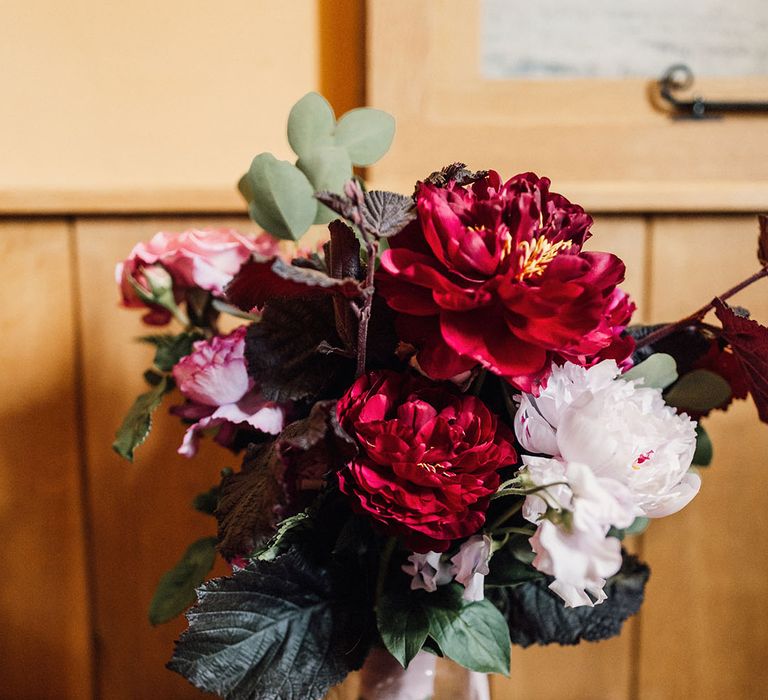 Dark red and light pink peony bridal bouquet for the traditional and romantic wedding at Cripps Barn