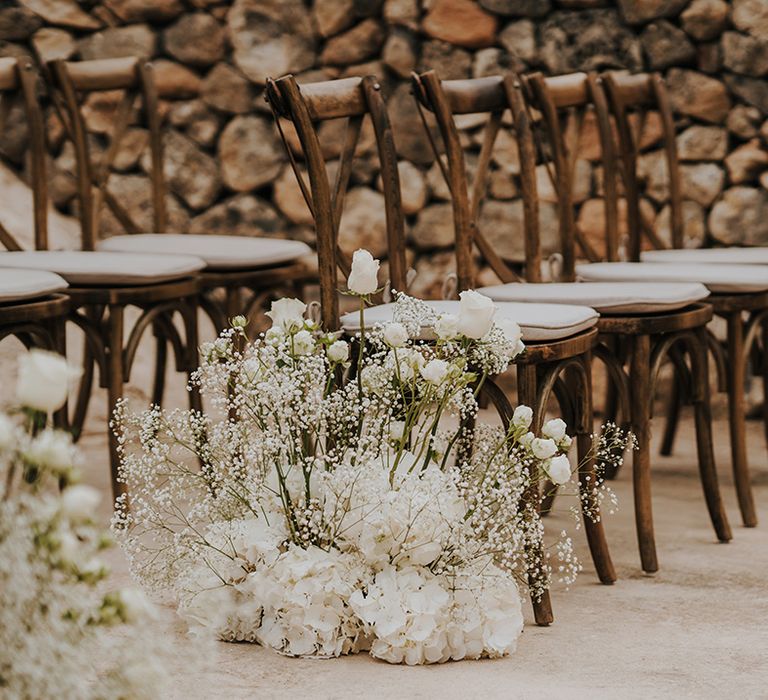 white hydrangea gypsophila and rose wedding aisle flower arrangements