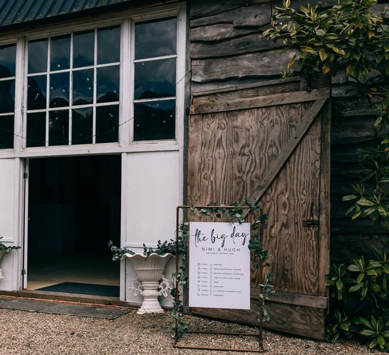 Exterior of Templars Barn wedding venue with botanical wedding stationery 