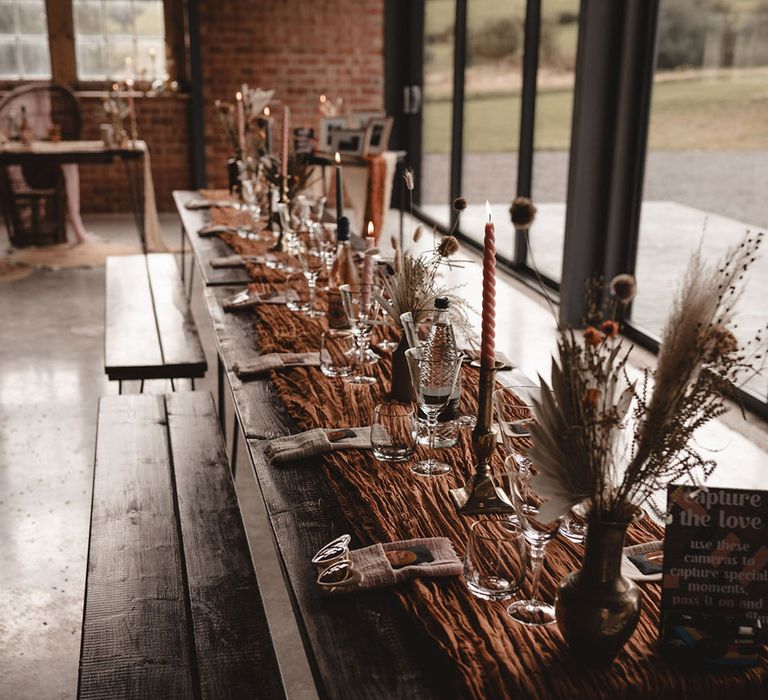 Boho wedding tablescape at The Giraffe Shed with retro wedding decorations 