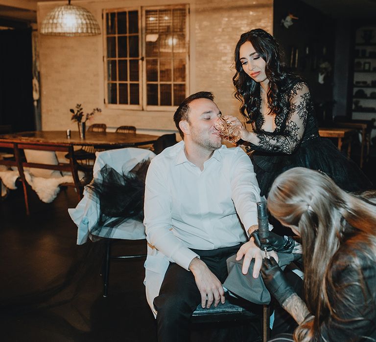 Groom gets a tattoo on the wedding day in place of the traditional wedding band 