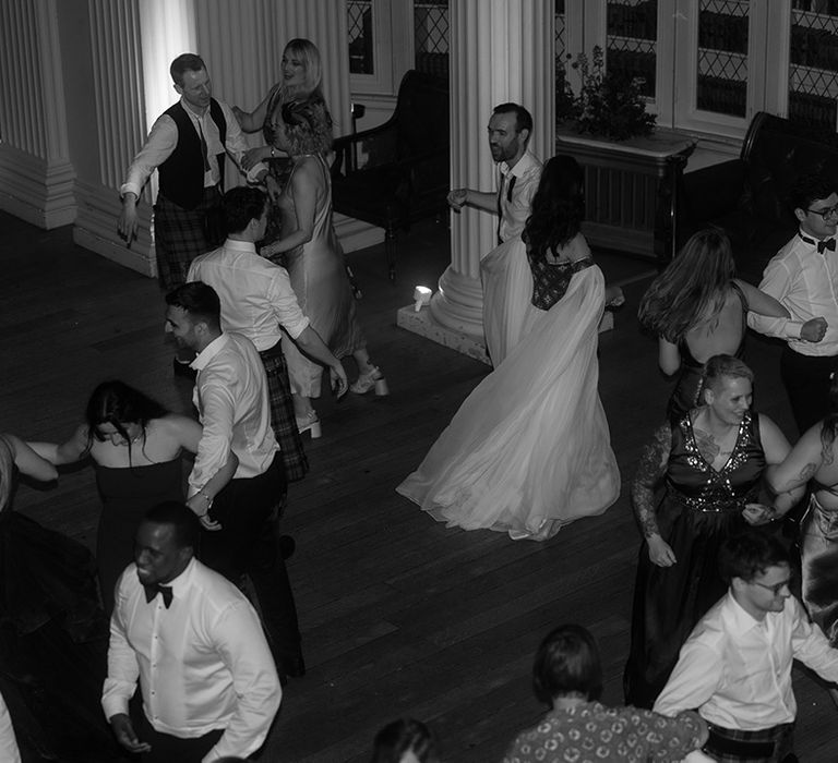 The wedding guests fill the dancefloor 