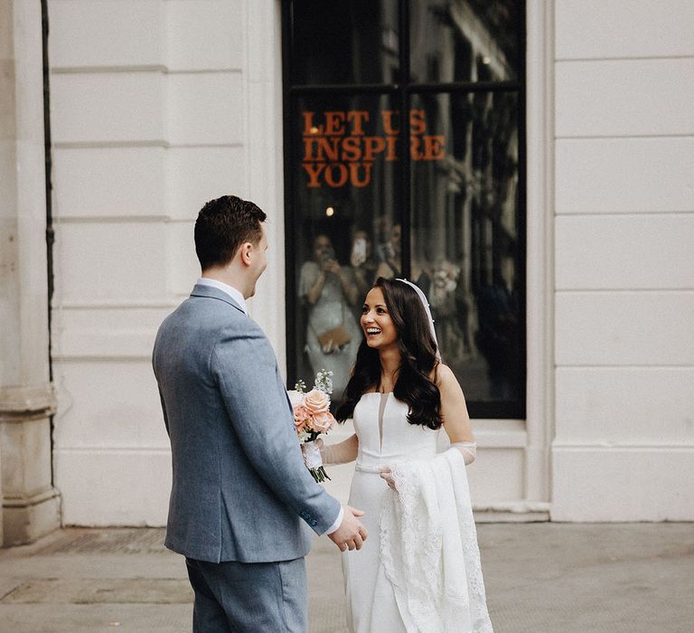 The bride and groom share a romantic and intimate first look between them 