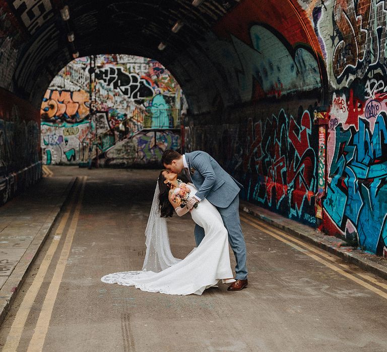 Graffiti urban backdrop for city wedding in London with urban chic wedding theme