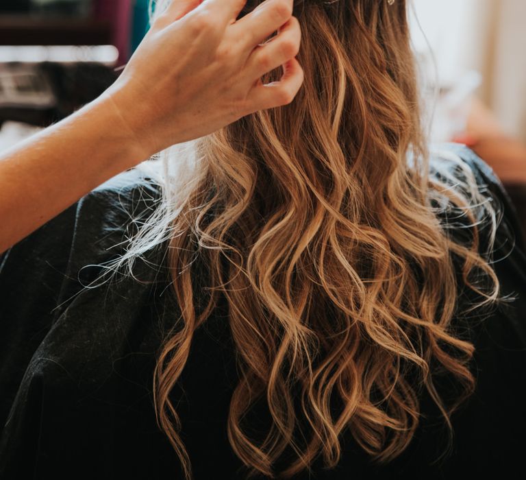 Bride with half up half down hair and hair vine 