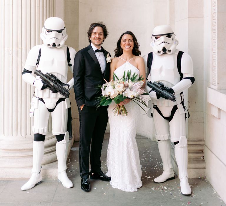 Couple on their wedding day with stormtroopers