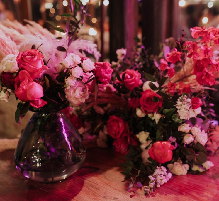 Bright pink wedding flower arrangements