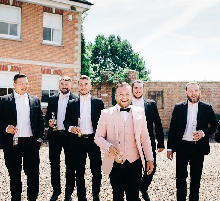 Pink groomsmen suits best sale