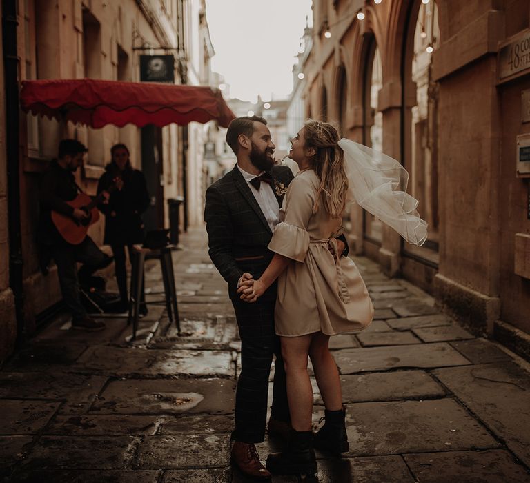 Bride and groom first dance in the street