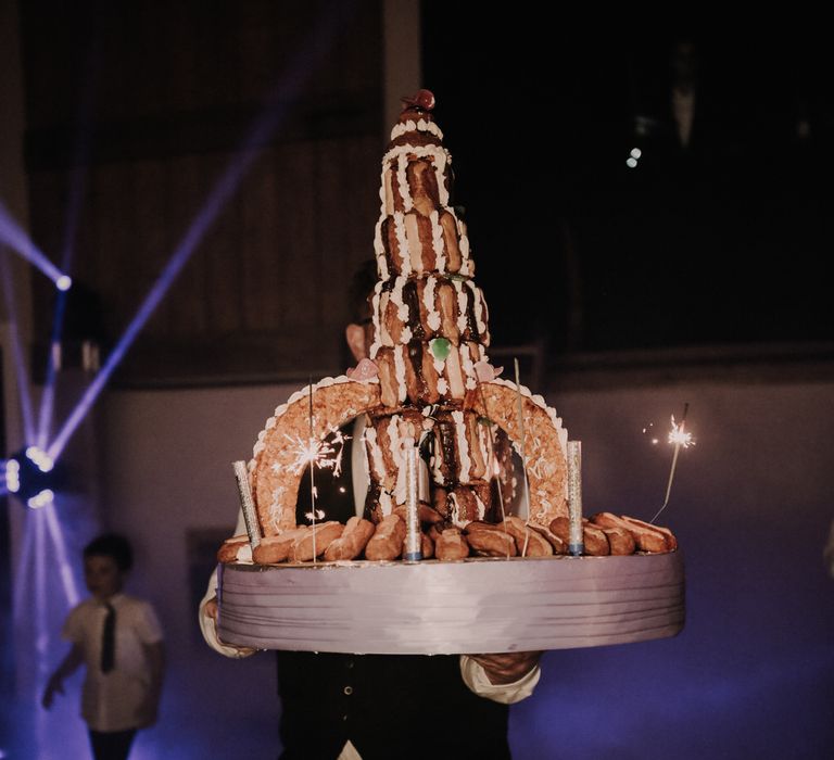 An eight tier eclair wedding cake in the shape of a rocket