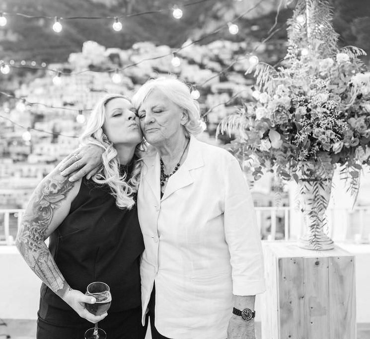 The bride with her mother, hugging after the ceremony