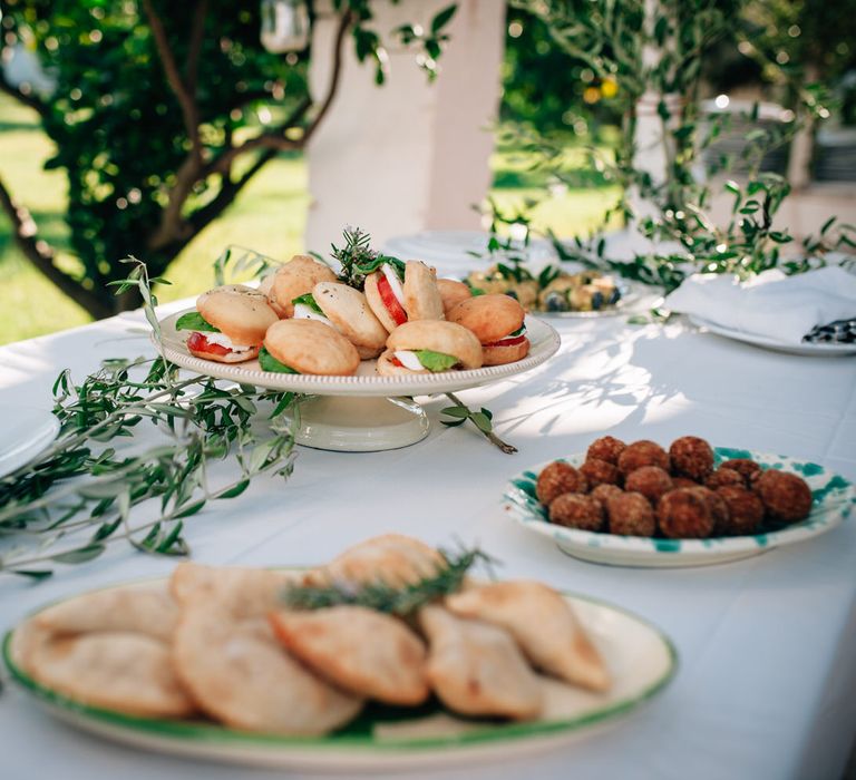 Food table with Italian appetisers