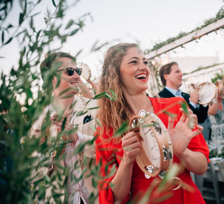 Guests cheering with their personalised tambourines