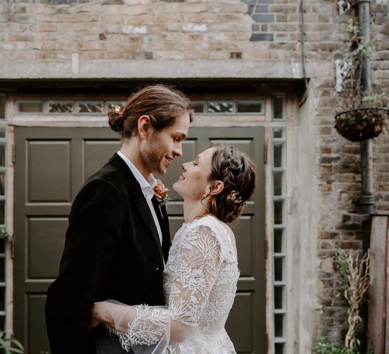 Bride and groom holding each other on their wedding day