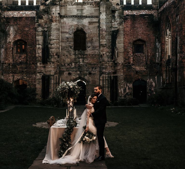 Unique bombed out church wedding venue in Liverpool with intimate wedding reception table 