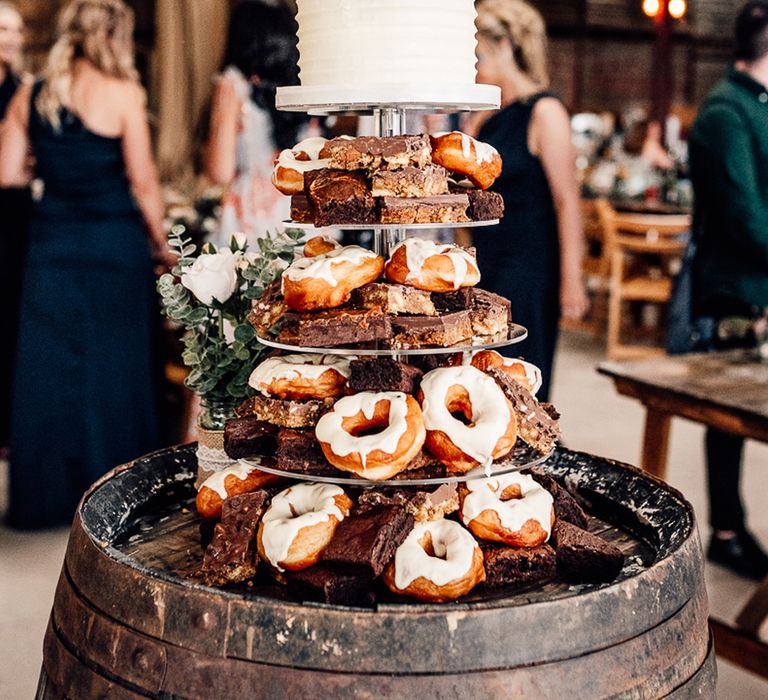 Delicious wedding cake with doughnuts and brownies