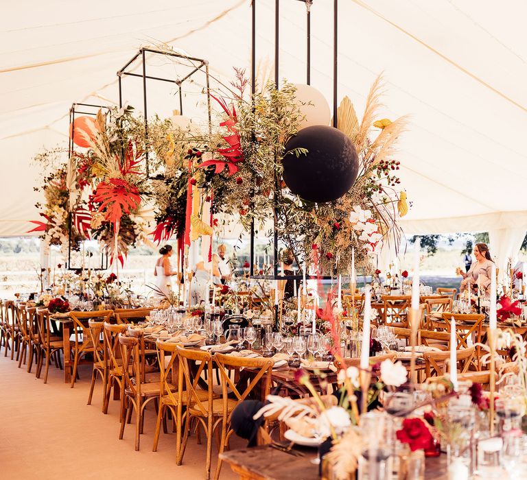 Hanging dried flower installation at marquee wedding