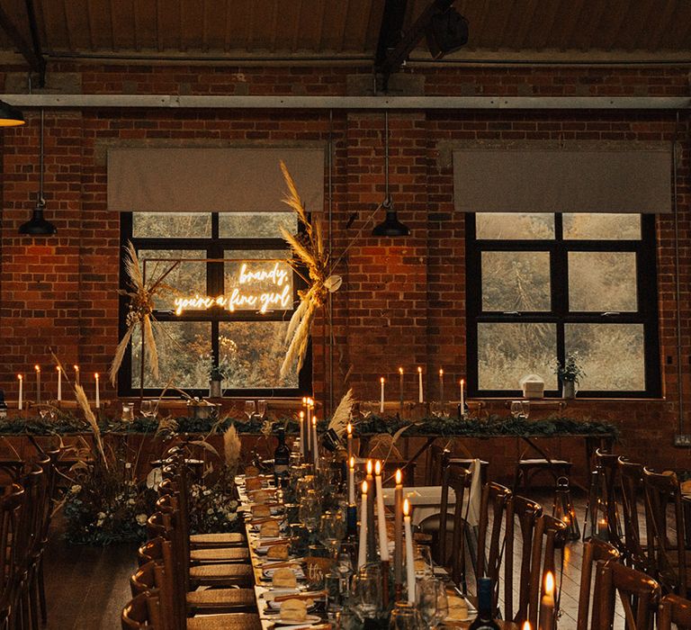 Brass arch complete with neon sign and pampas grass decor for reception at the Venue Bowers Mill